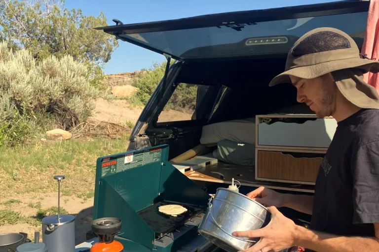 Cooking from the truck camper galley in the field